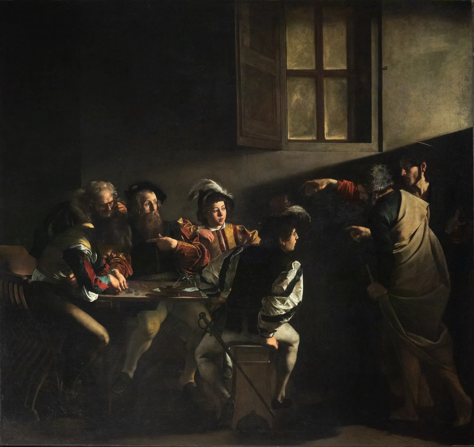 The Calling of Saint Matthew in full: a dark room with five men at a table on the left in contemporary Roman dress counting money, two robed figures standing at the right, and one shaft of light entering high from the right that lands as a hard wedge across the back wall above their heads.