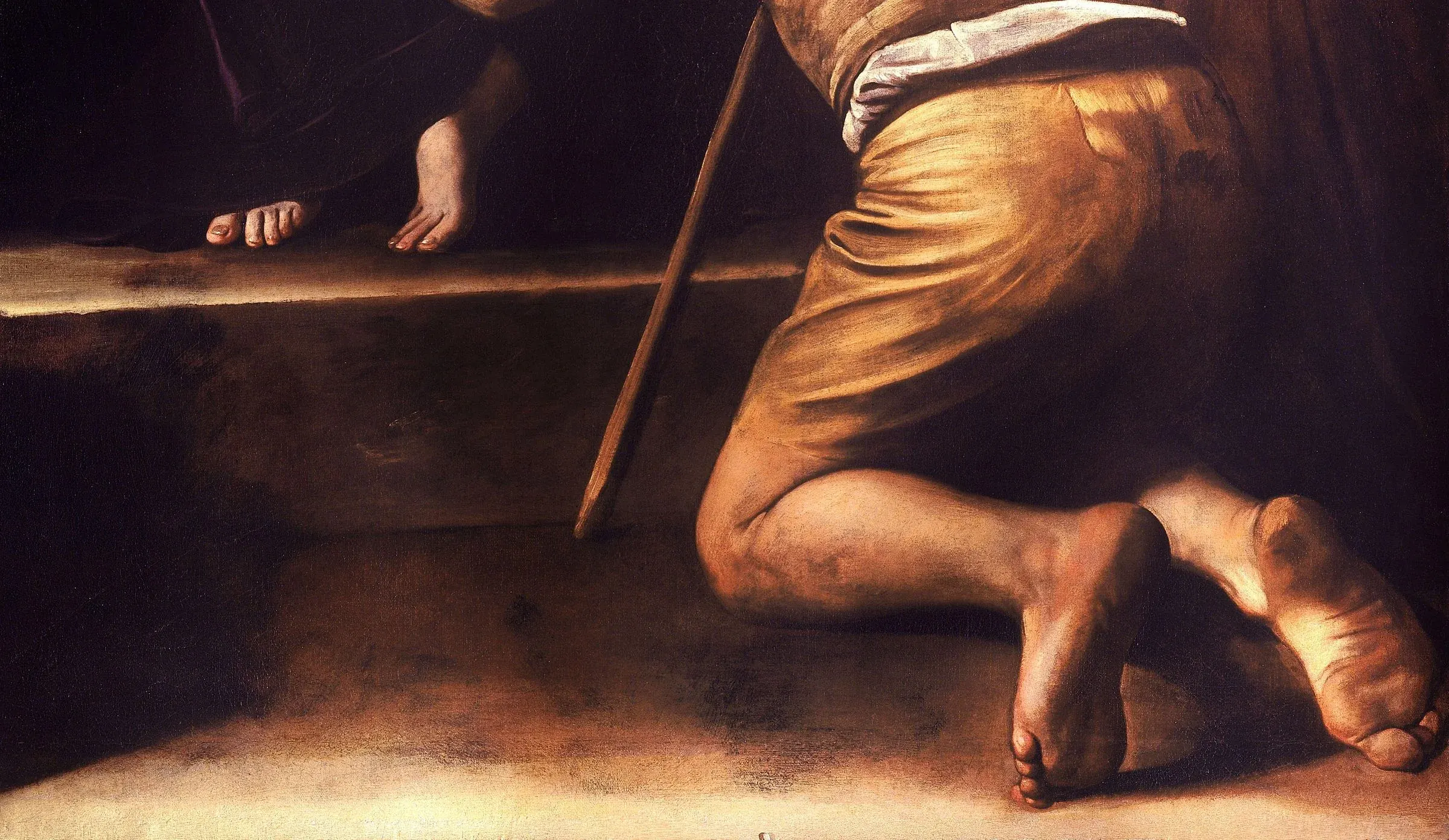 Detail of the Madonna di Loreto: the kneeling pilgrim's bare soles are turned out at the viewer, cracked and grimed, and they get the same careful light as the Madonna's clean feet on the step above. The beggar and the saint are painted by the same rules.