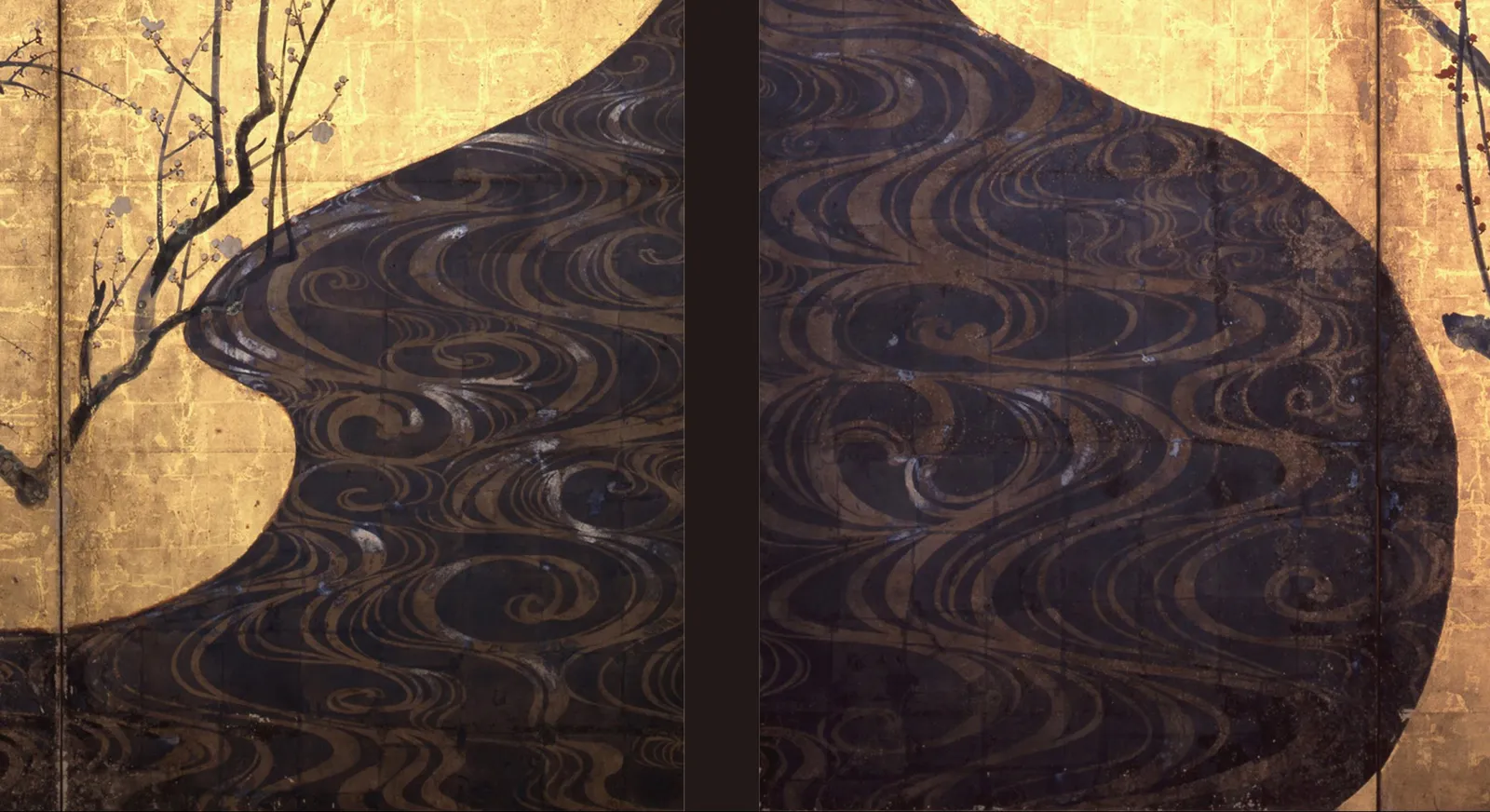 The river between the two screens of Red and White Plum Blossoms. A swirling pattern is drawn over the field in a paler tone and everything around it now reads close to black. Testing found silver leaf under the whole area, and sulphur in the parts that have not turned yet. The gold ground on either side of it has not moved.
