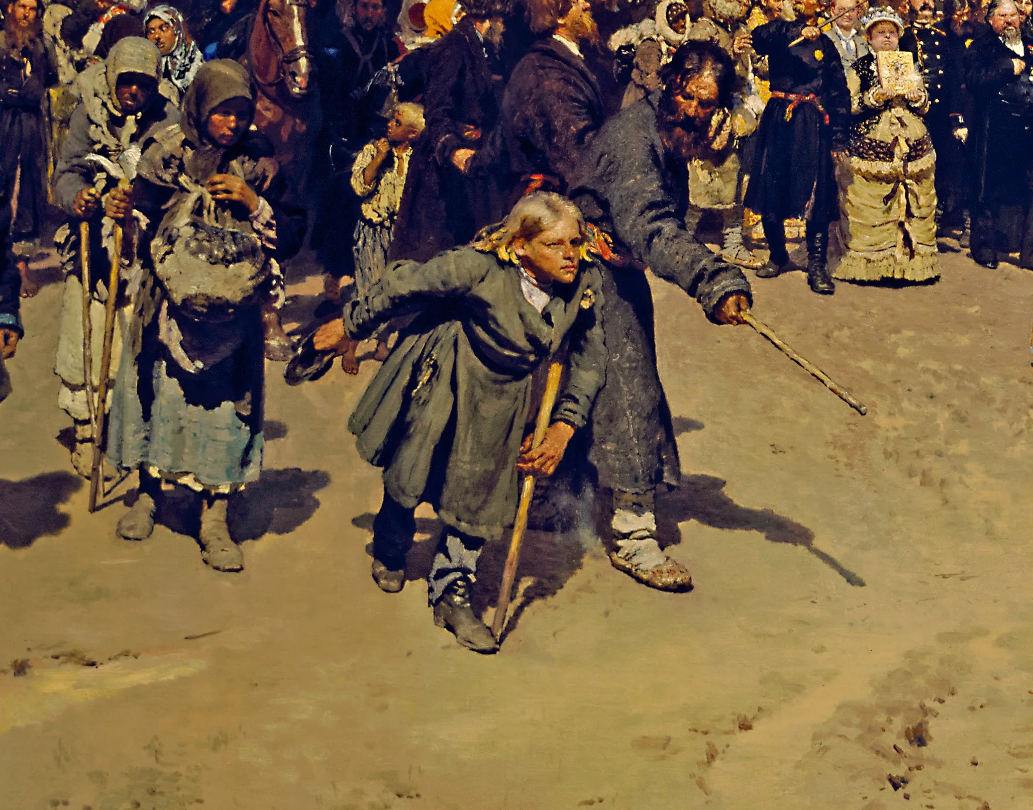 Detail of Religious Procession in Kursk Province: the hunchbacked boy lunging forward on his stick, the ragged pilgrim women on crutches beside him, an official swinging a whip to hold the line. Each figure in the crowd is a separate type Repin built from a study, not a face repeated from a formula.