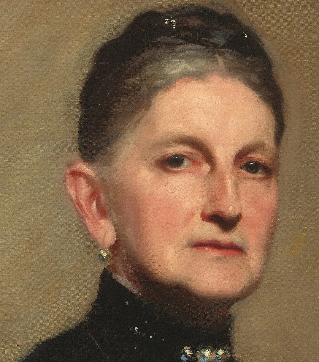 Detail of Mrs. Adrian Iselin: the light crosses the forehead and the far cheek while the shadow gathers on the ear side of the face and under the jaw, and that one boundary carries the structure of the whole head. The eye, the nostril and the mouth are small marks set inside it rather than drawn first and filled in.