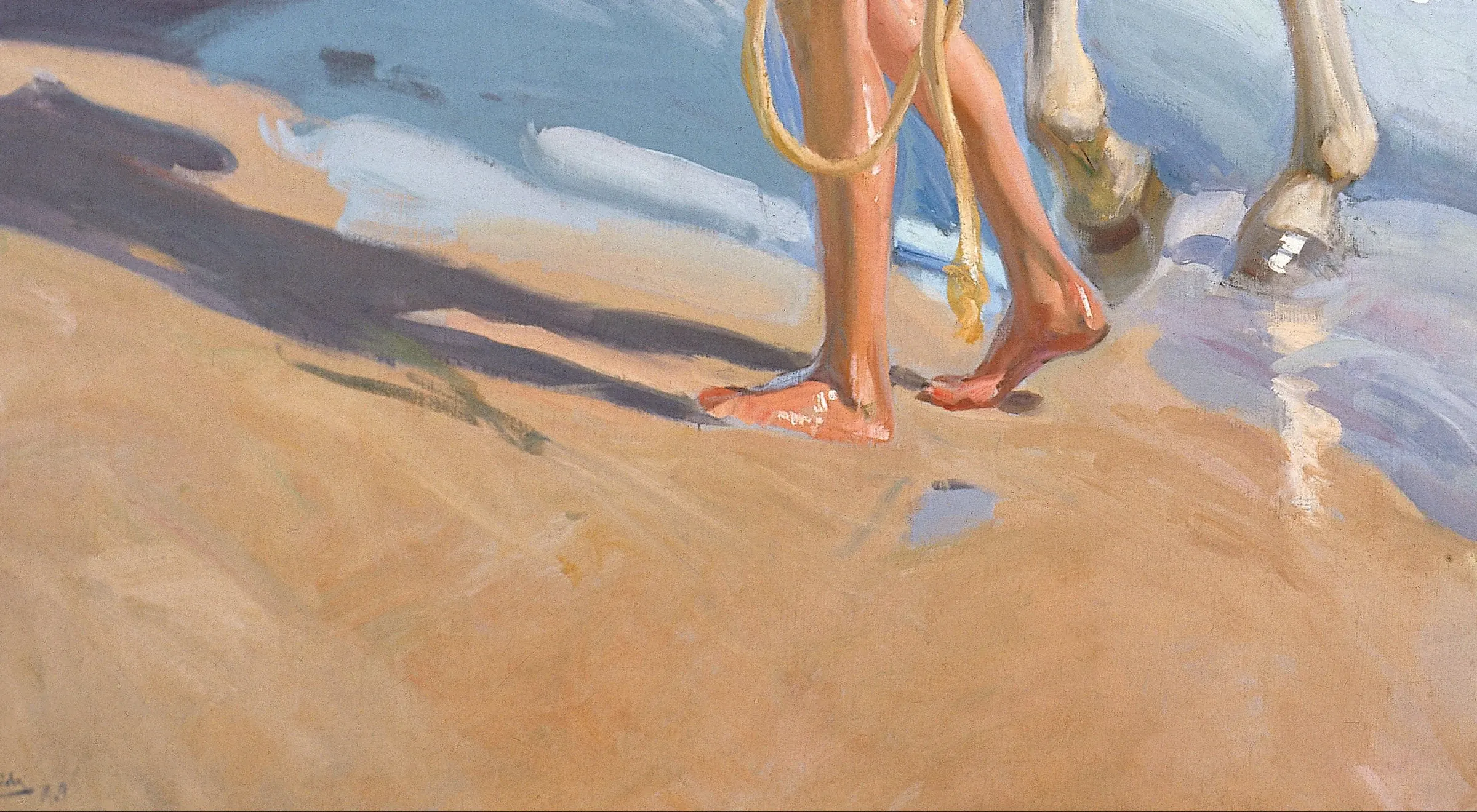 Detail of El baño del caballo at the boy's feet: the reflection is not painted under him, it is painted as its own cool shape lying flat on the wet surface. The long shadow behind is violet and blue and it holds that colour all the way to the edge of the picture.