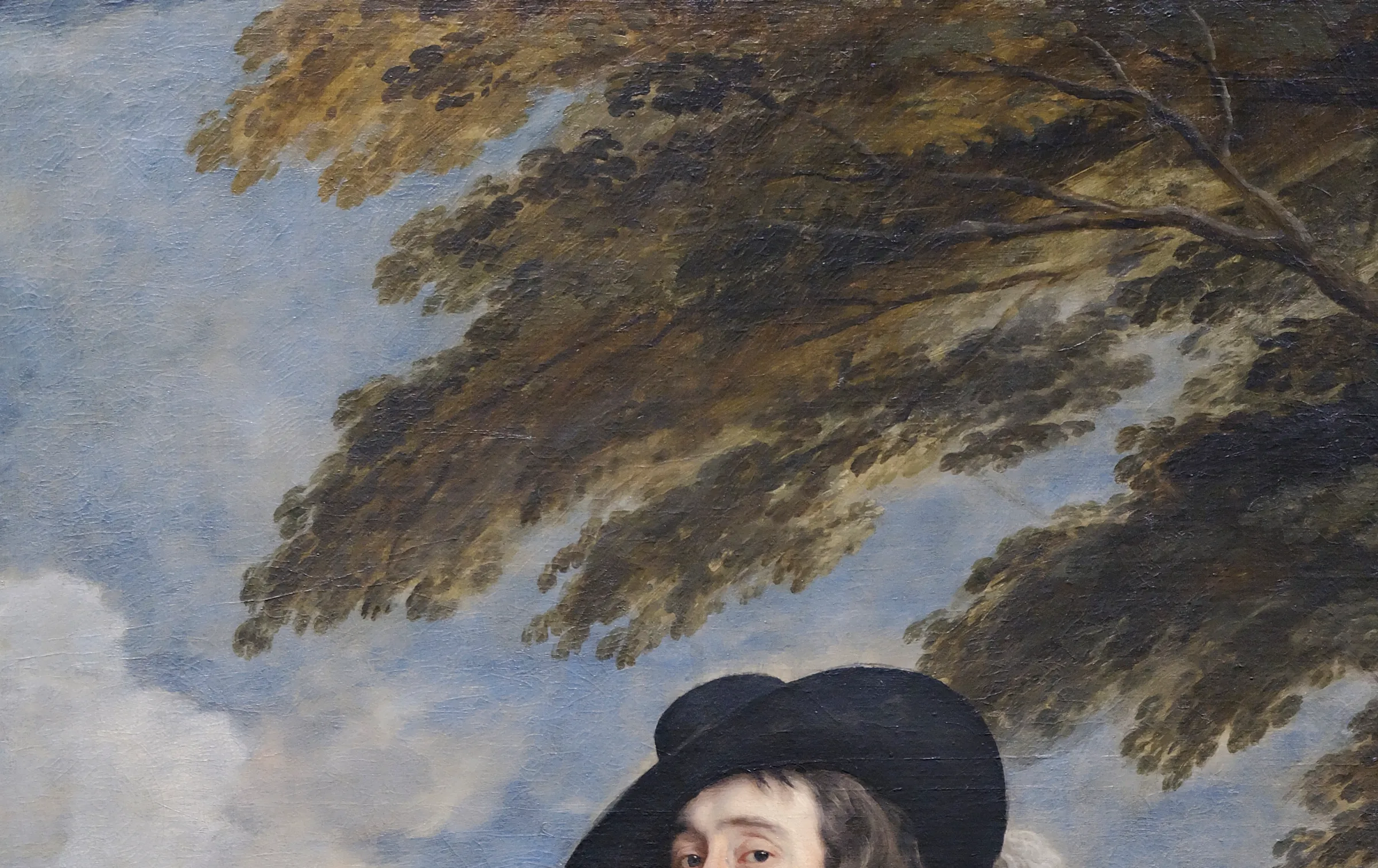 Detail above the King's hat in Charles I at the Hunt: the canopy is a few loaded drags of grey green over a thin sky and not one leaf is drawn. The setting is left at the speed of a sketch on purpose, so the figure standing under it is the only fully resolved thing in the picture.