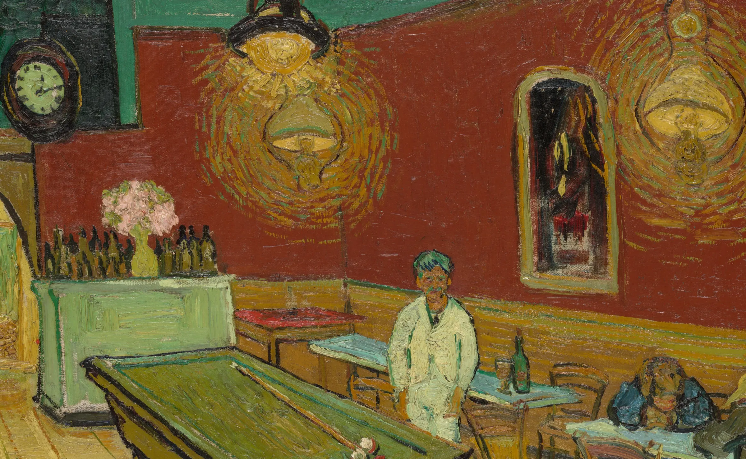 Detail of the Night Cafe: the red wall runs straight into the green ceiling with nothing neutral between them, and the gas lamps are ringed with orange strokes laid over green. The one figure in the room is painted in pale green so it reads against the red without being a third colour.