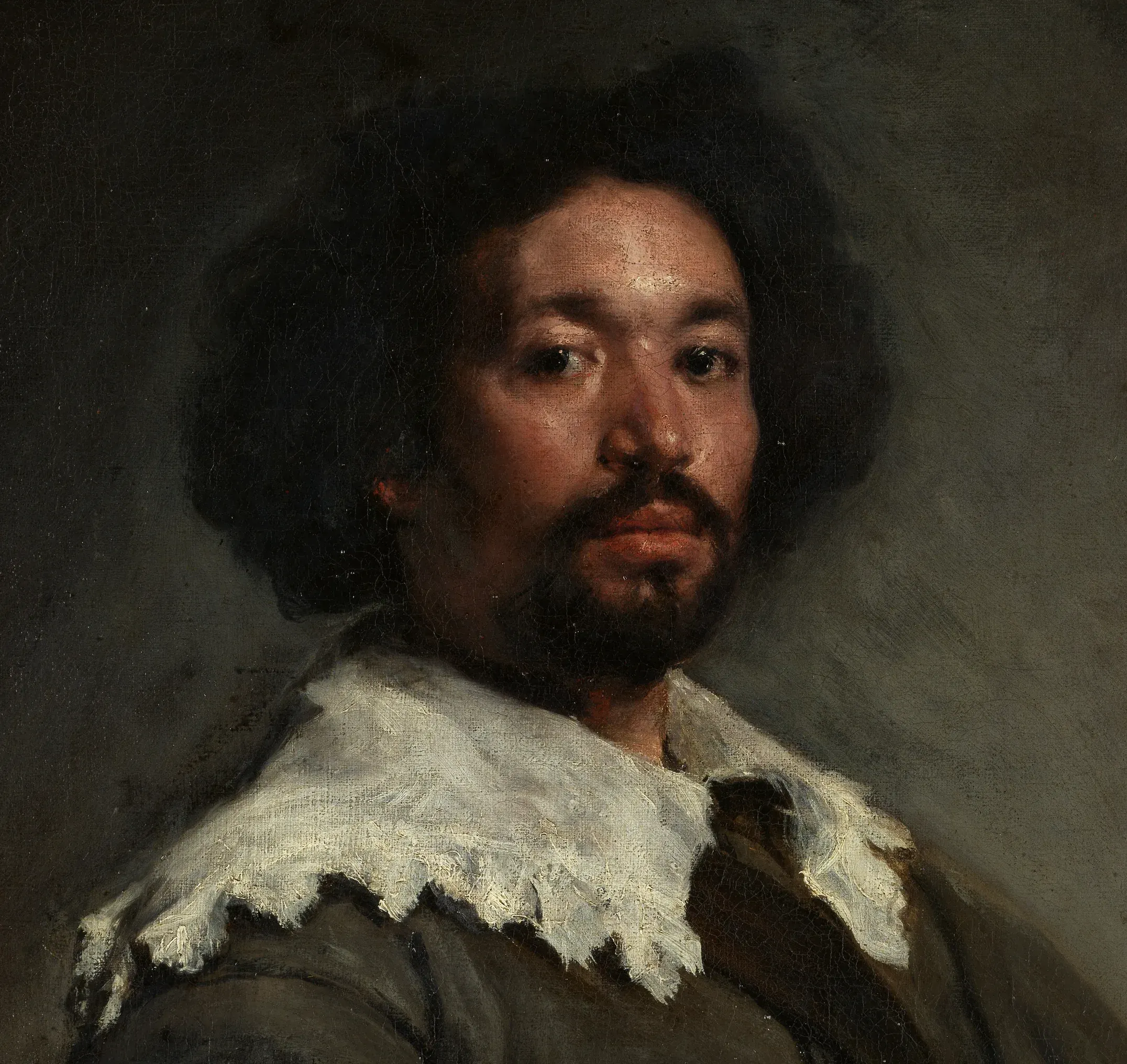 Detail of Juan de Pareja: the whole restrained head turns on a handful of loaded whites, the ragged collar struck in wet and left standing, the brightest note held back for last.