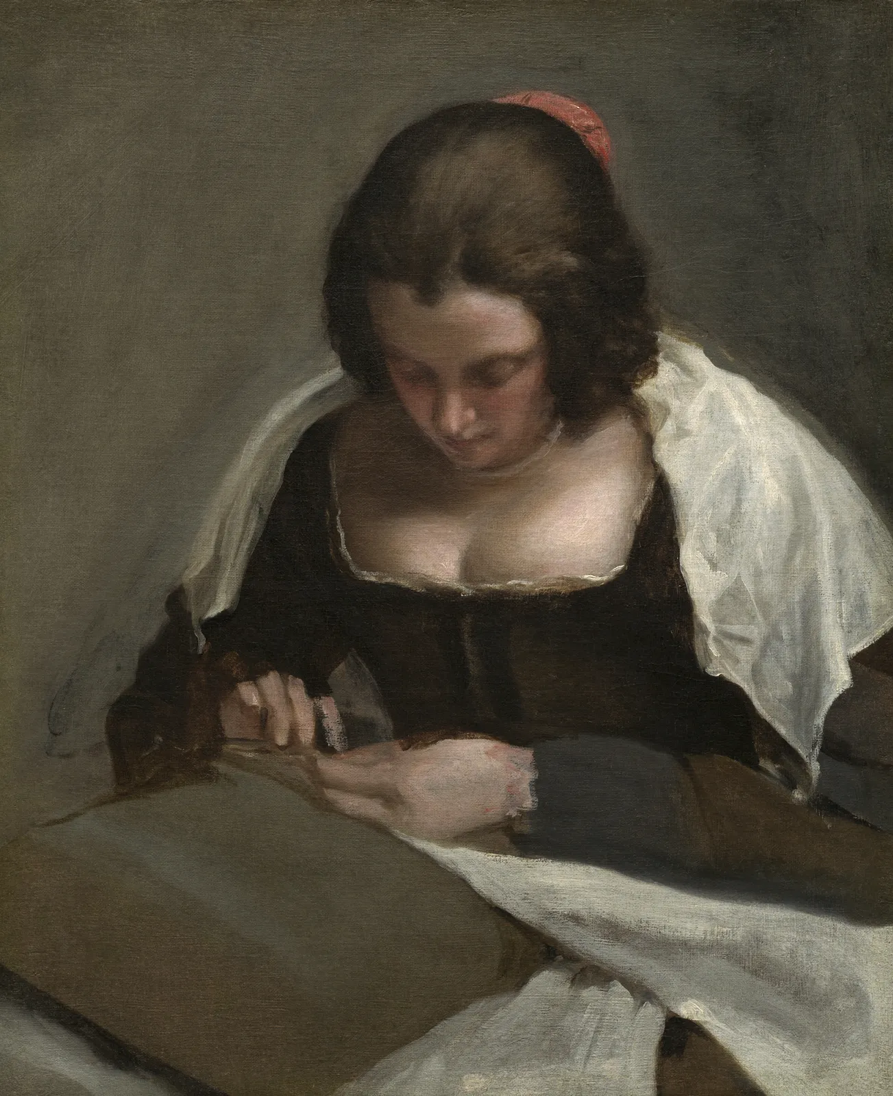 The Needlewoman, left unfinished: the head is carried to a finish while the hands are still sketched in, and everywhere the picture stops it is the toned priming that carries the middle value. That tone was in the canvas before the first stroke, so the work left to do was the lights and the darks.