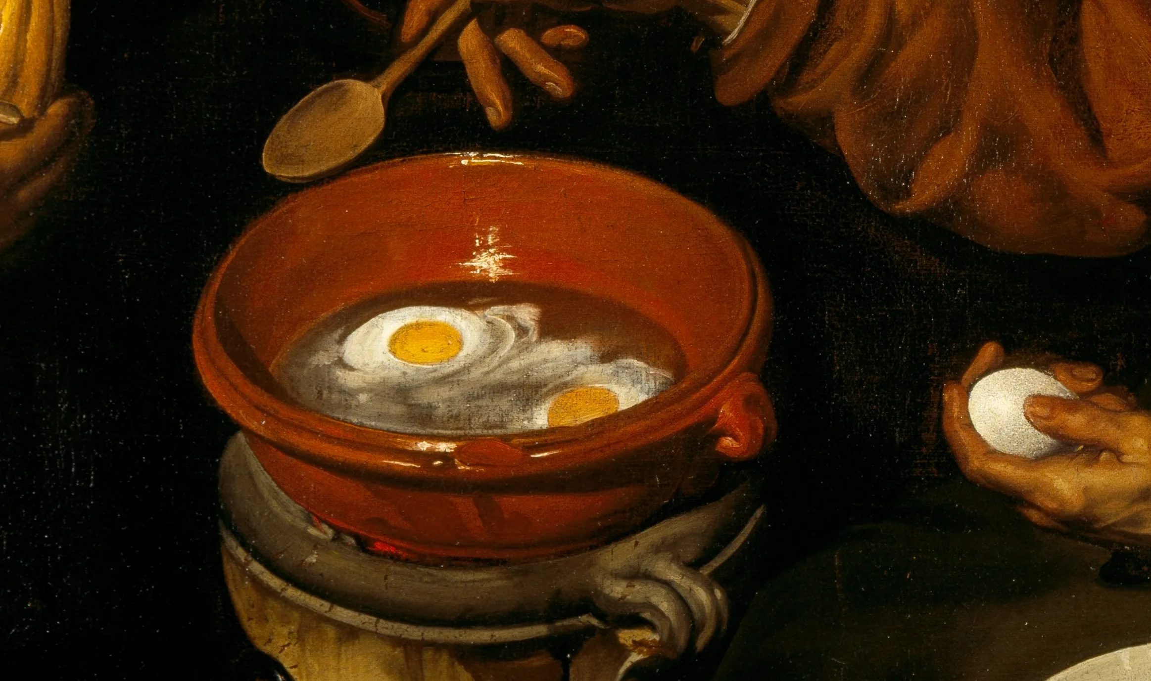 Detail of Old Woman Frying Eggs: the eggs setting in hot oil, the clear white turning opaque at the rim, the red earthenware and the brass each built from its own weight of paint. He was about nineteen when he painted the states of matter this closely.