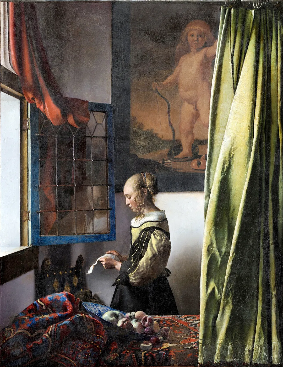 Girl Reading a Letter at an Open Window after the Dresden restoration: the large Cupid on the back wall had been under overpaint for more than two centuries, and laboratory work showed that overpaint went on decades after Vermeer died. The picture he actually made has the god of love standing over the letter, lit from the same window.