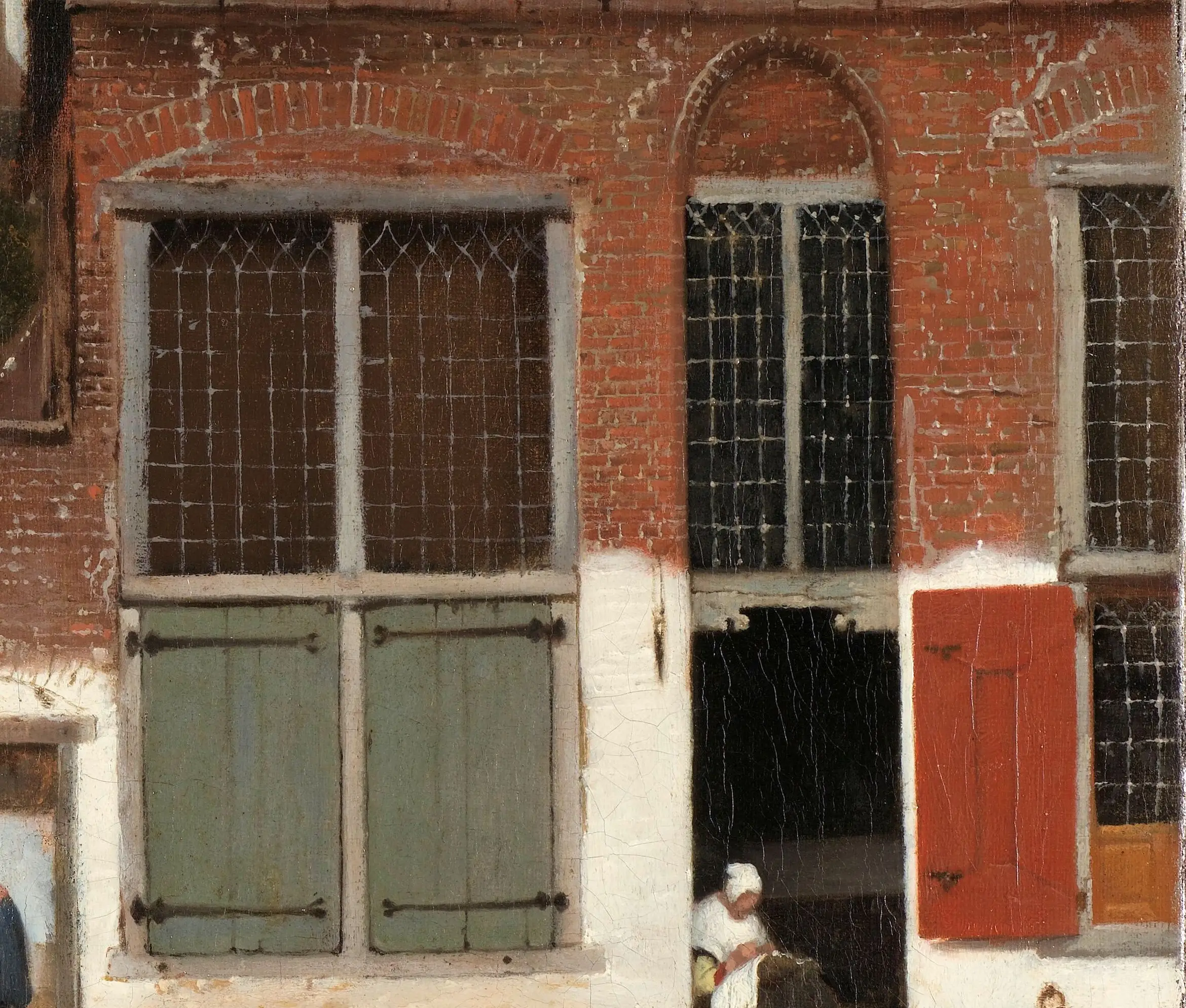 Detail of The Little Street: the brick is one warm red mass with the mortar drawn back into it in short pale strokes, and the whitewash along the bottom of the wall is a separate opaque band laid over the top. A whole house front comes out of two decisions about paint. Thick and dry for the wall, thin and dark for the openings.